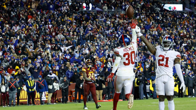 New York Giants players celebrate after making the final play to defeat the Washington Commanders